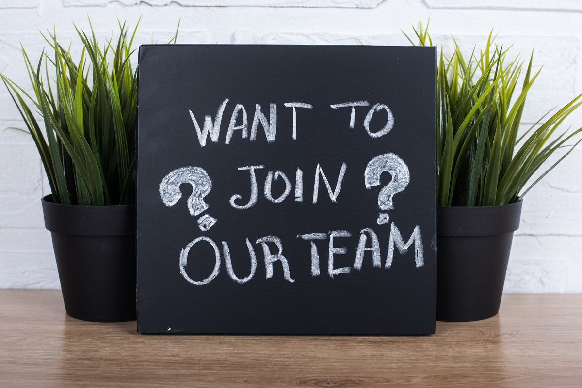Want to join our team written on black board