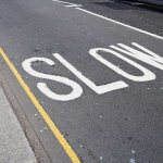 "SLOW" Road markings