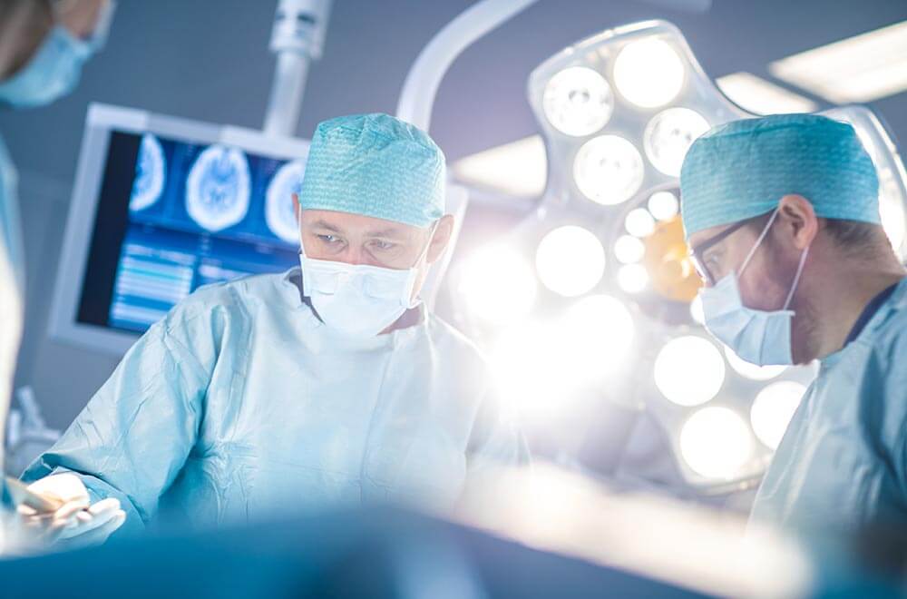 Surgeons operating on a patient with Serious Head, Brain or Spine Injury