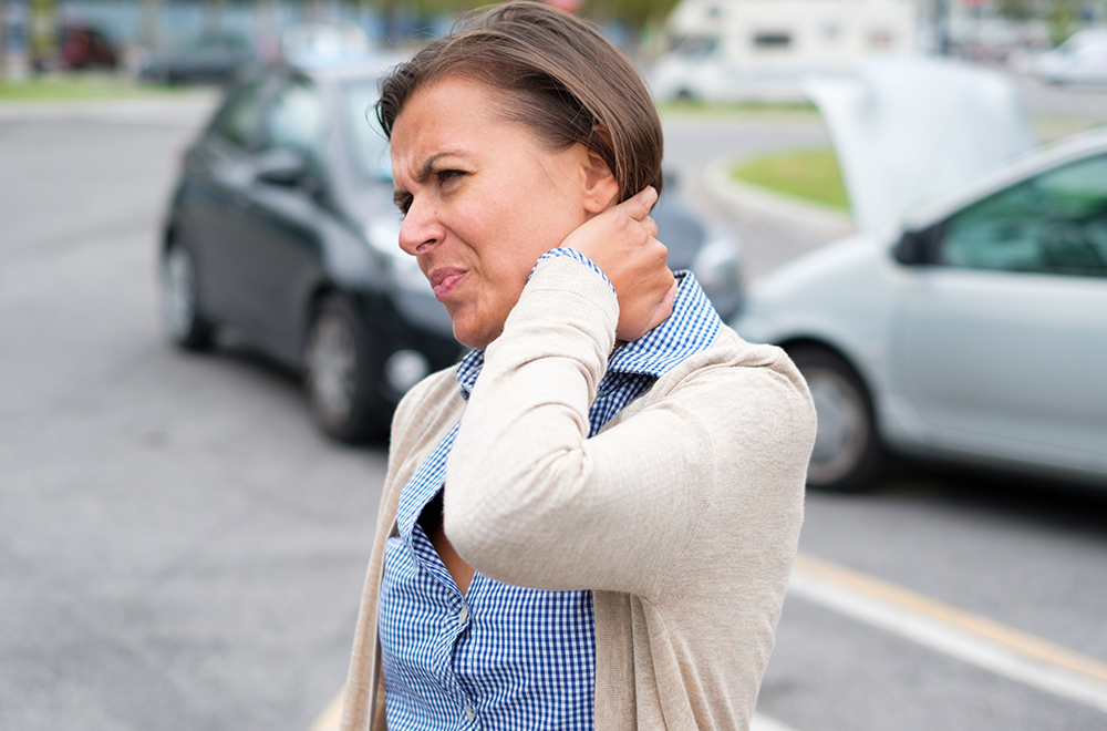 Woman suffering from Whiplash following a car crash