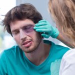 Man being treated for black eye sustained in an assault