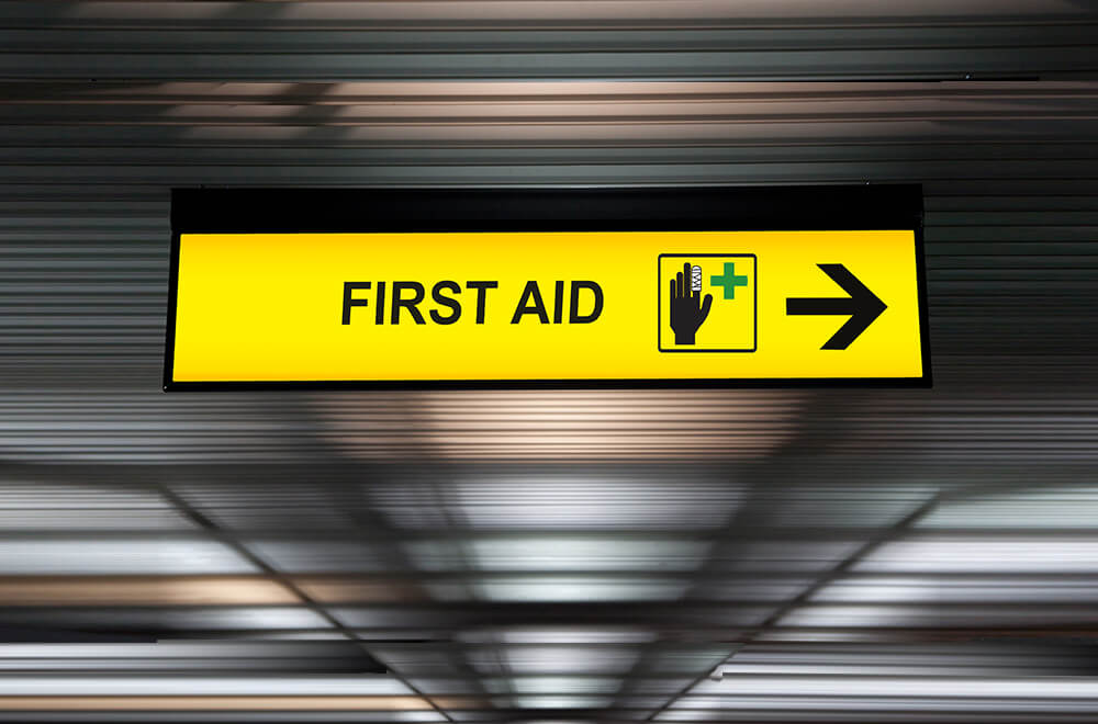 First Aid sign for injuries in a public place