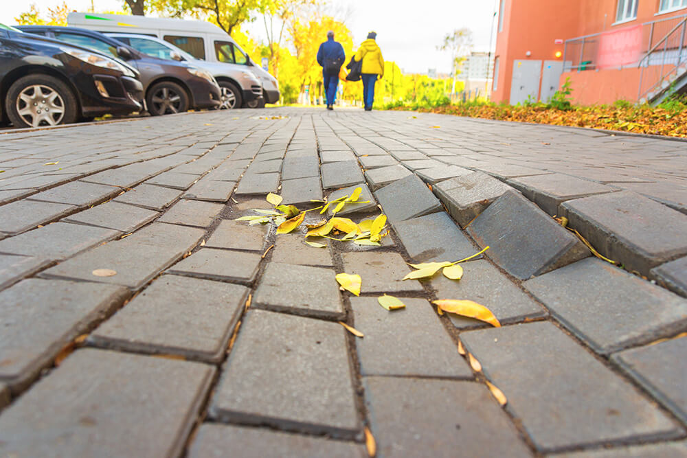 Broken, uneven paving which could cause an injury