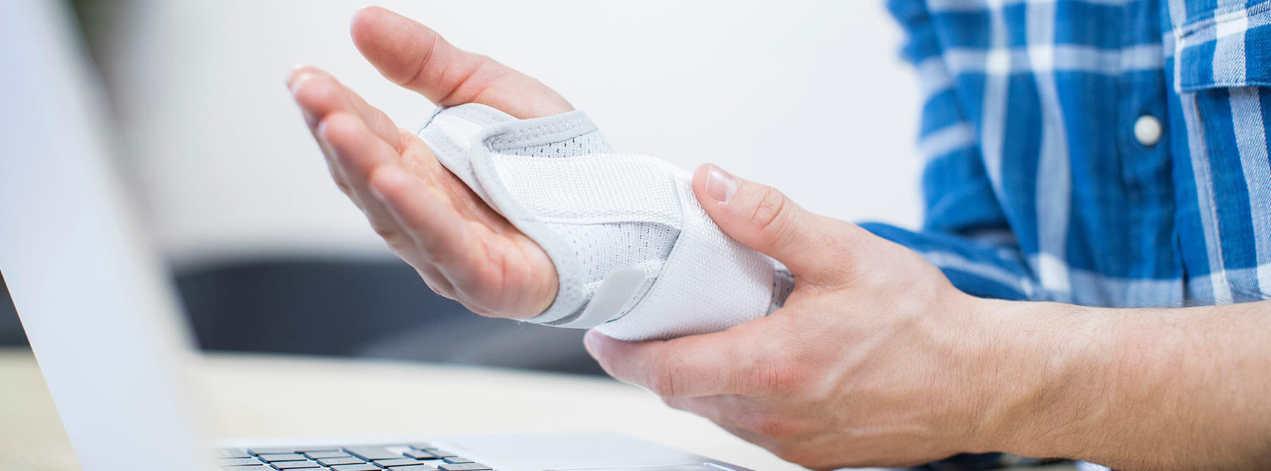 Man suffering from Repetitive Strain Injury (RSI)