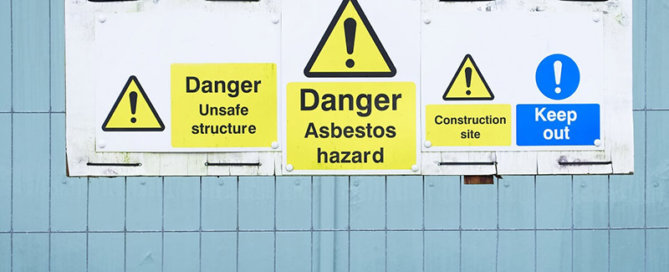 Asbestos warning signs on building