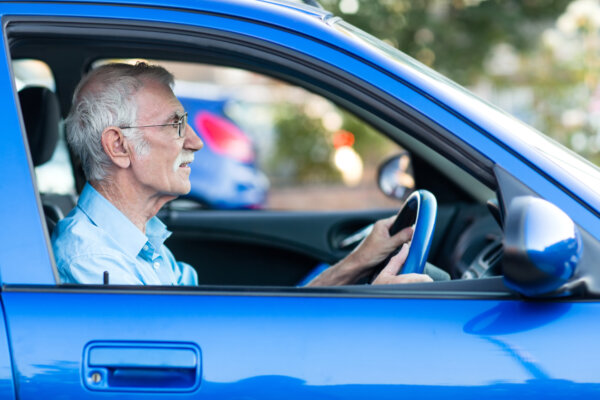 elderly man driving