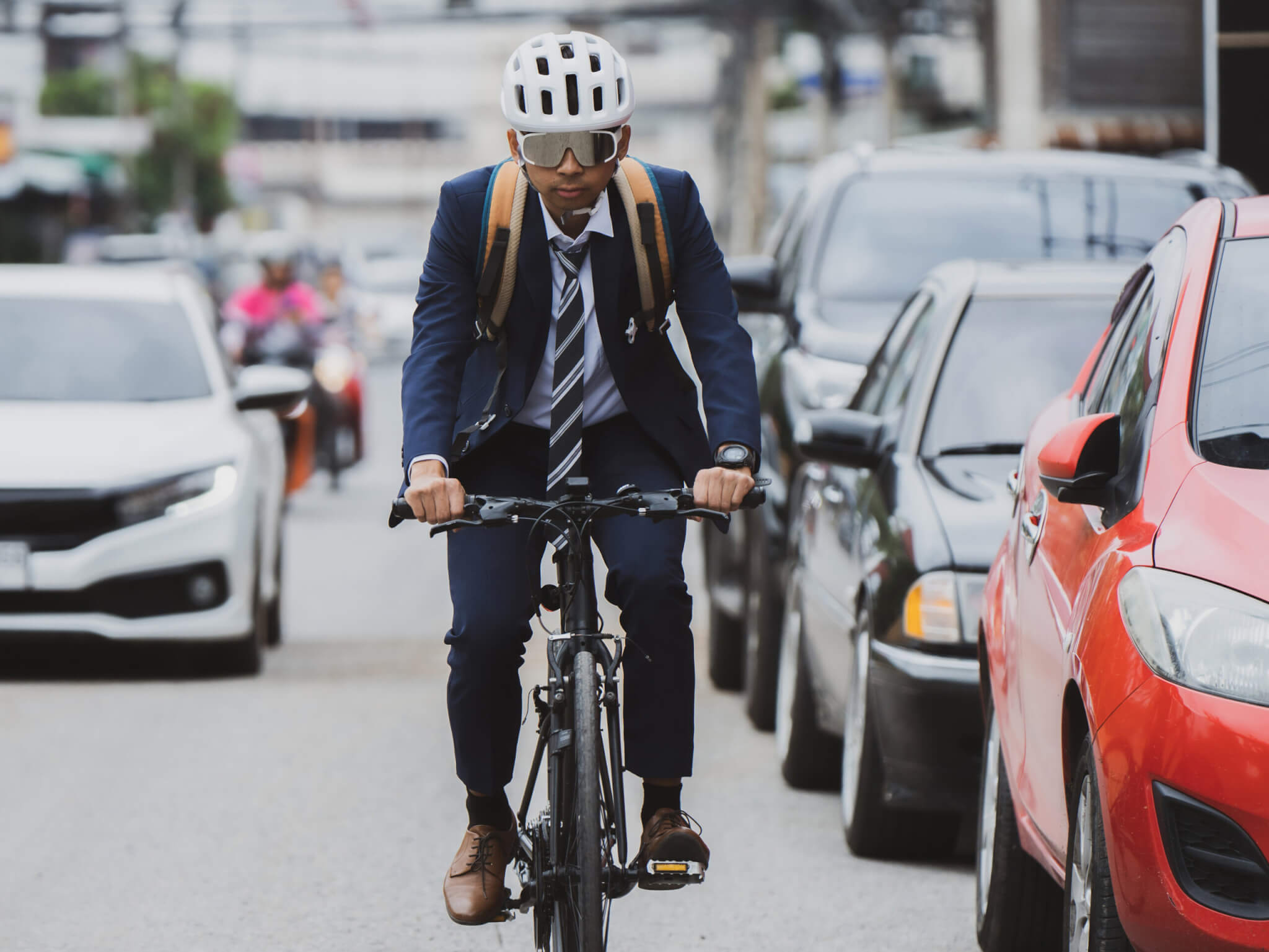 Cyclist in heavy traffic