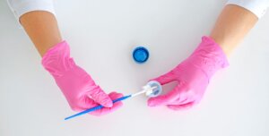 Cervical screening swab and sample jar