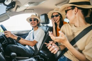 Group of friends in a car going on a road trip