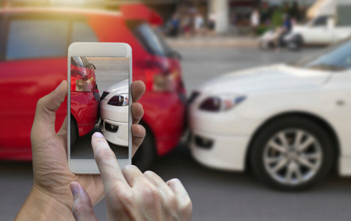 Taking a photo of a car accident