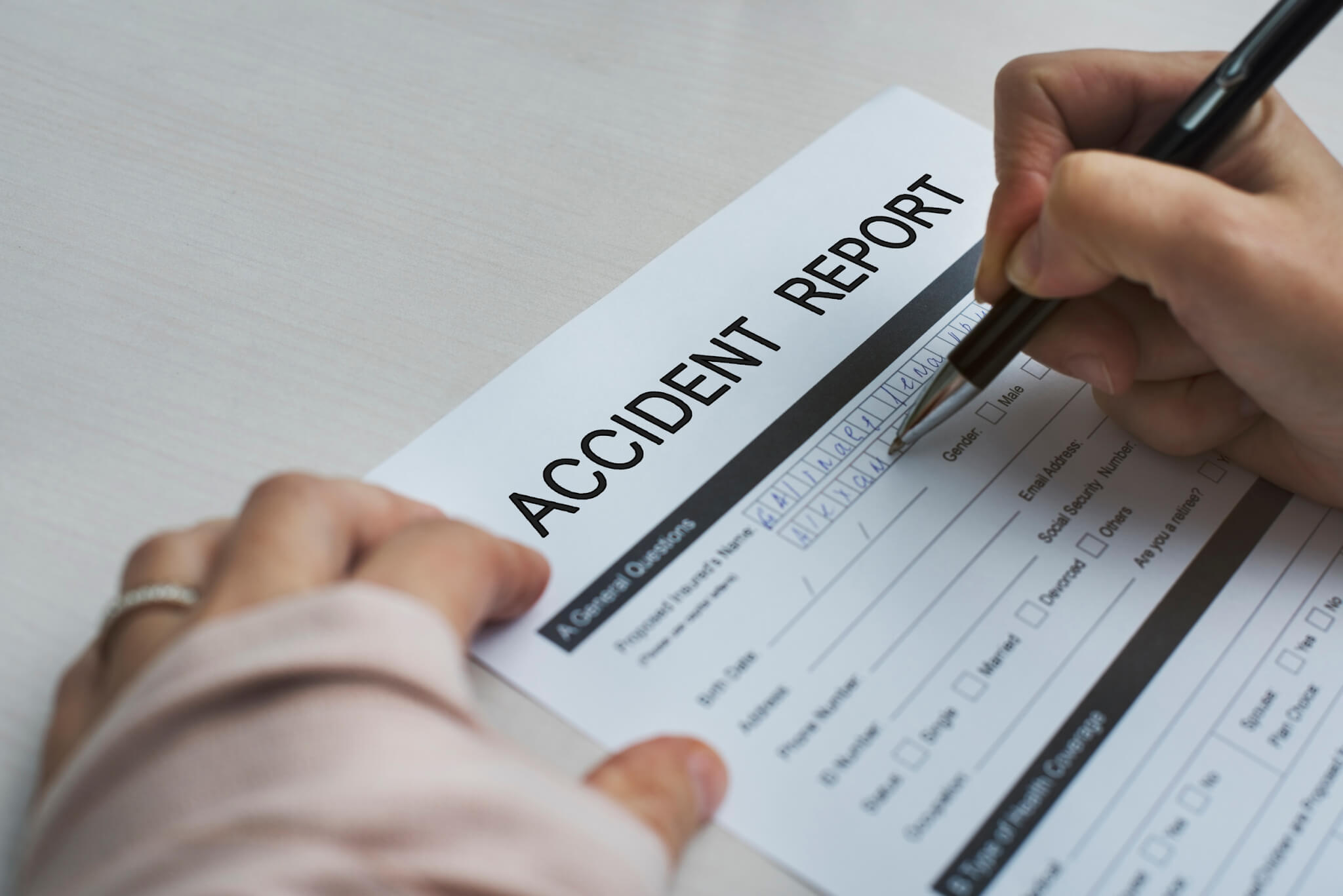 filling out an accident report form at work